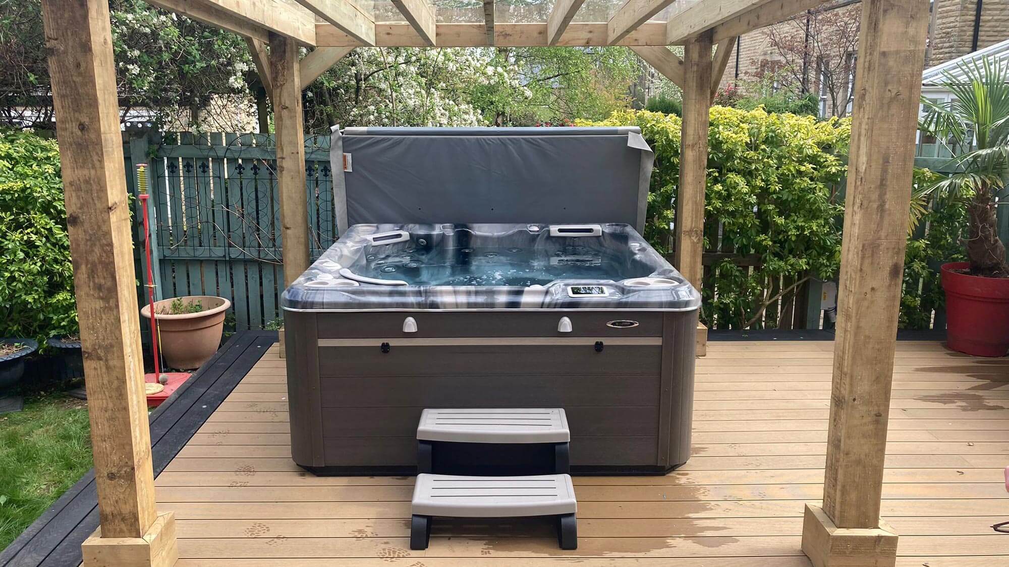 hot tub install on decking with pergola